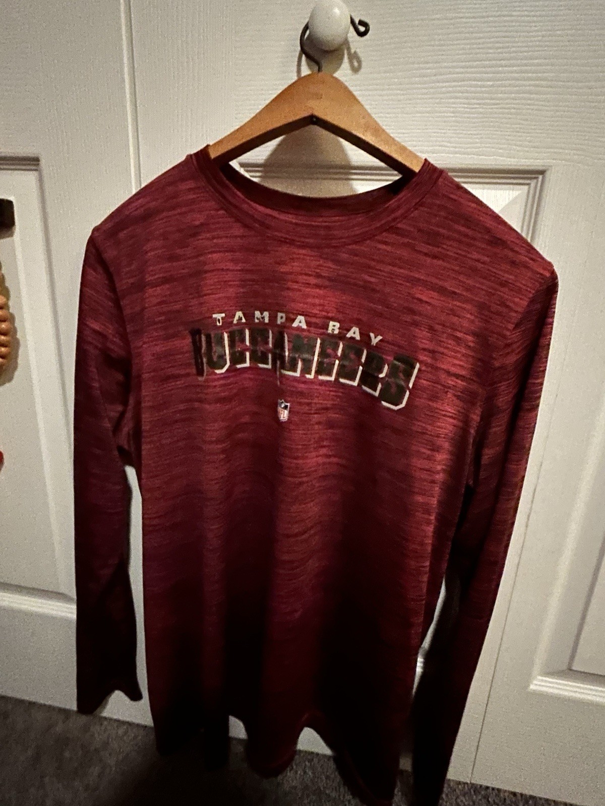 red Nike Dri-FIT training shirt With a black swoosh logo and heathered pattern gallery