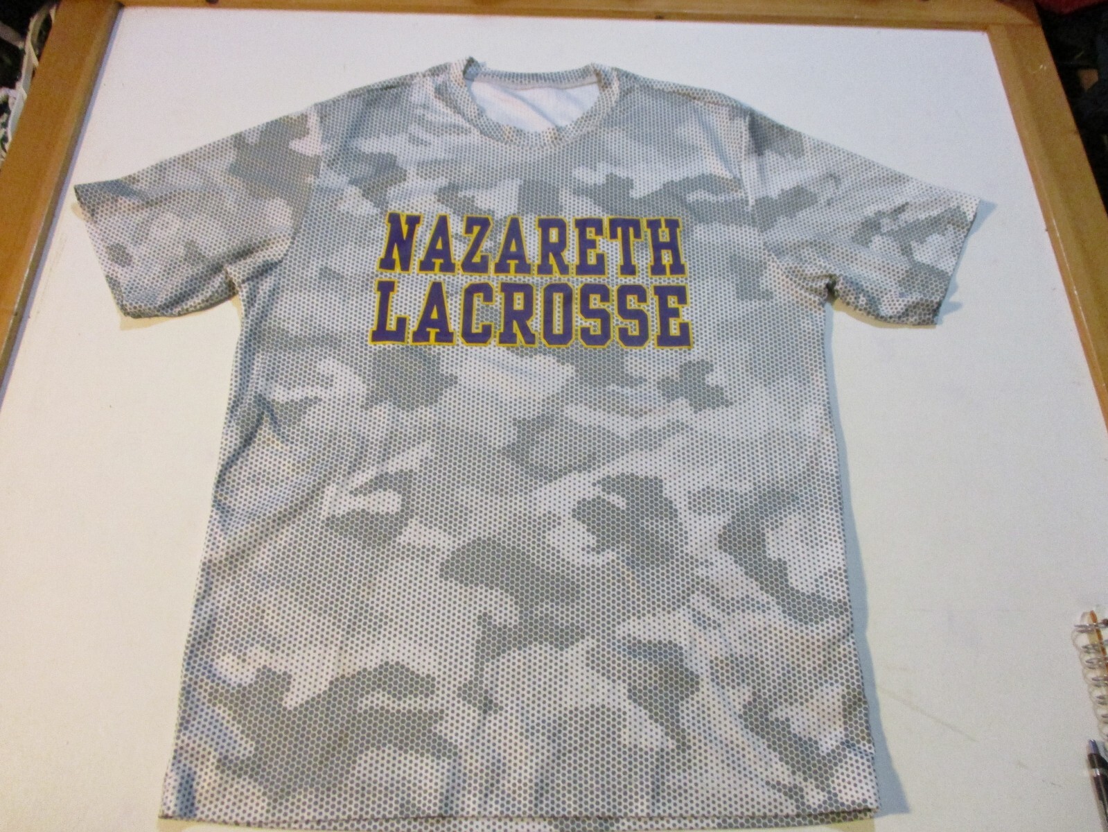 NAZARETH COLLEGE GOLDEN FLYERS LACROSSE CAMO PIXEL PRINT ATHLETIC SHIRT SM/MED gallery