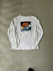 The Nike TEE BRIGHT CERAMIC GRAPHIC LONG SLEEVE TEE TOP White Large