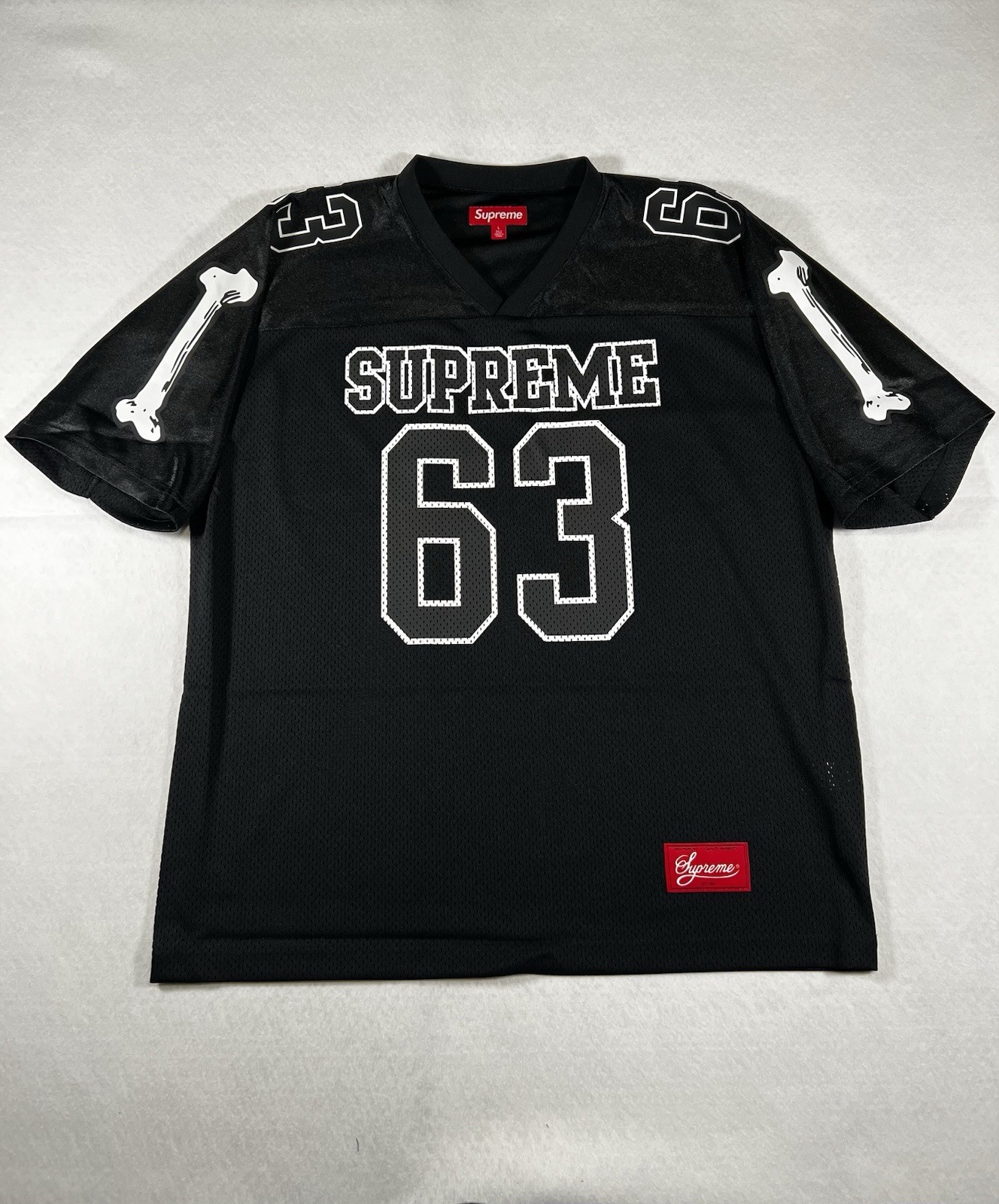 SUPREME BONES FOOTBALL JERSEY BLACK FW25 SIZE L IN HAND READY TO SHIP NOW gallery