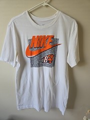 The Nike Tee Med Dri-Fit White/Orange with Bucknell Bison Logo