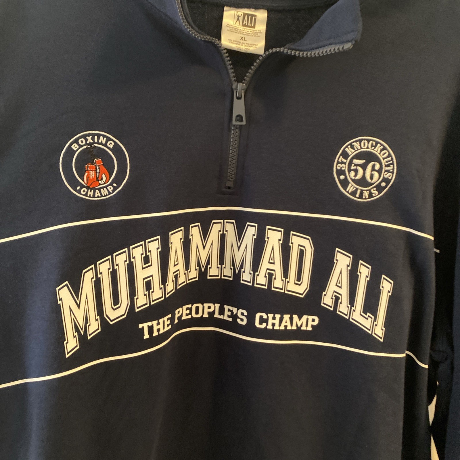 BRAND NEW WITH TAGS. Muhammad Ali Boxing. Size XL. Quarter Zip. Navy Graphic gallery