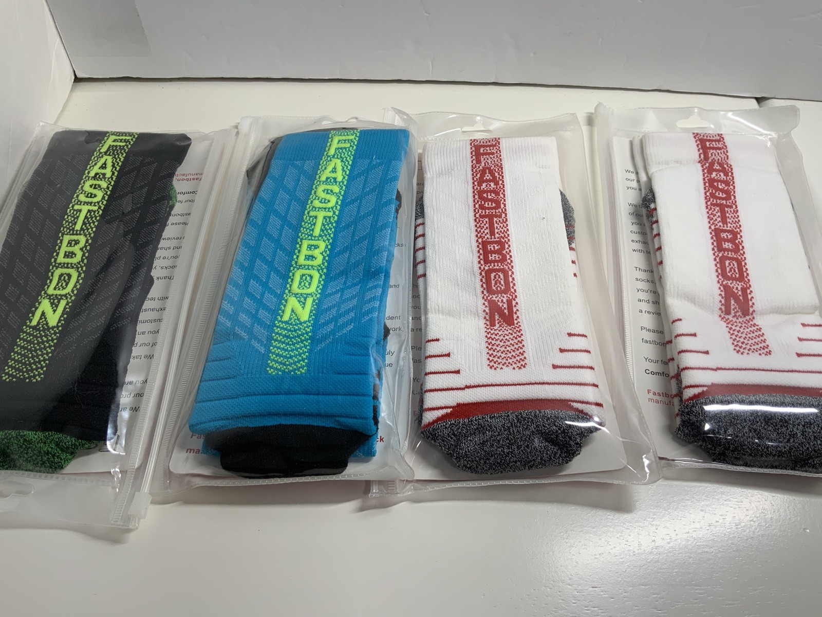 Four Pair Of Fastbon Long Compression Athletic Socks Large 9-12 gallery