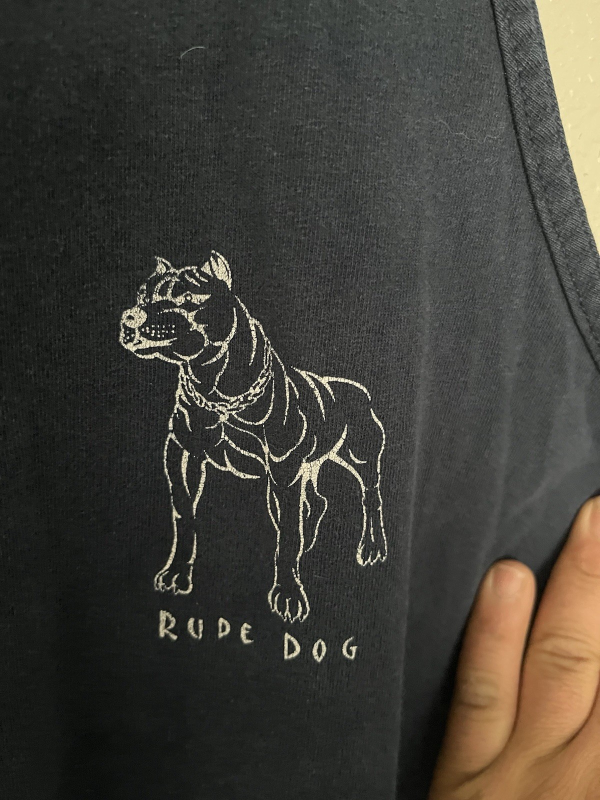 This vintage 1990s Rude Dogs tank top features a graphic of a pitbull with chai gallery