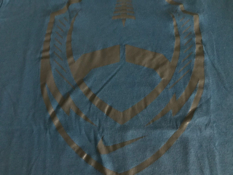 Nike Mens Fits like Small (Marked as Medium) Tee Shirt Blue with Football Logo gallery