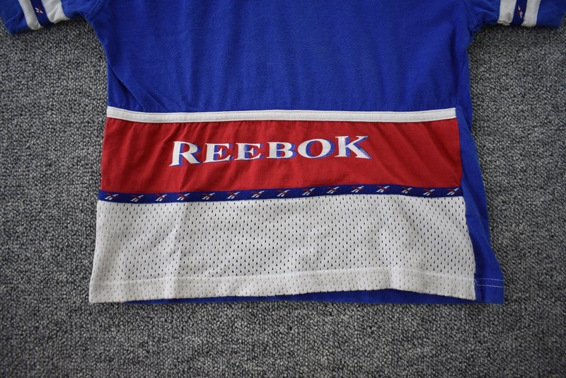 Vintage 90s Reebok Tee Mens XS Blue Red Spell Out Color Block Short Sleeve gallery