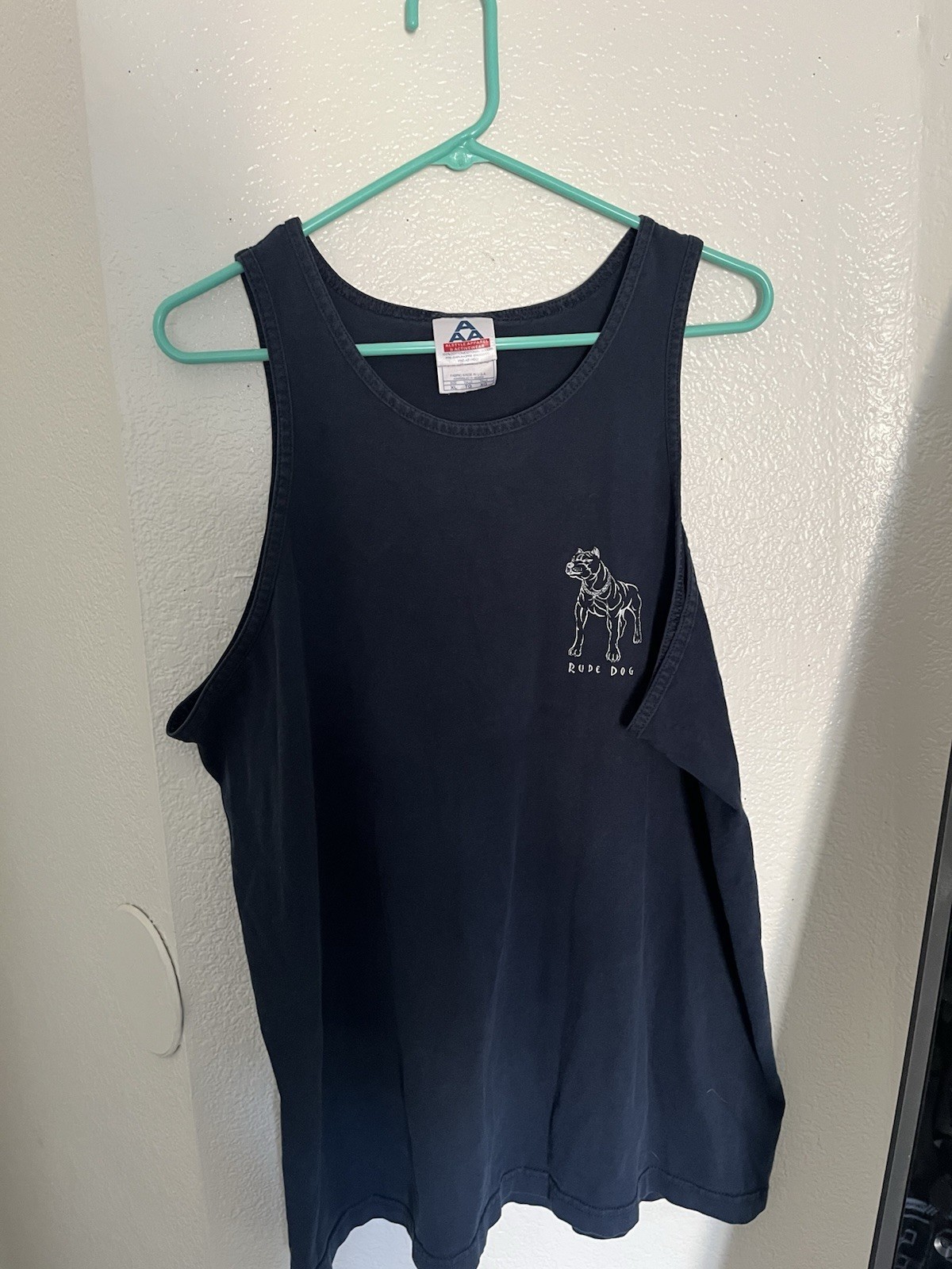 This vintage 1990s Rude Dogs tank top features a graphic of a pitbull with chai gallery