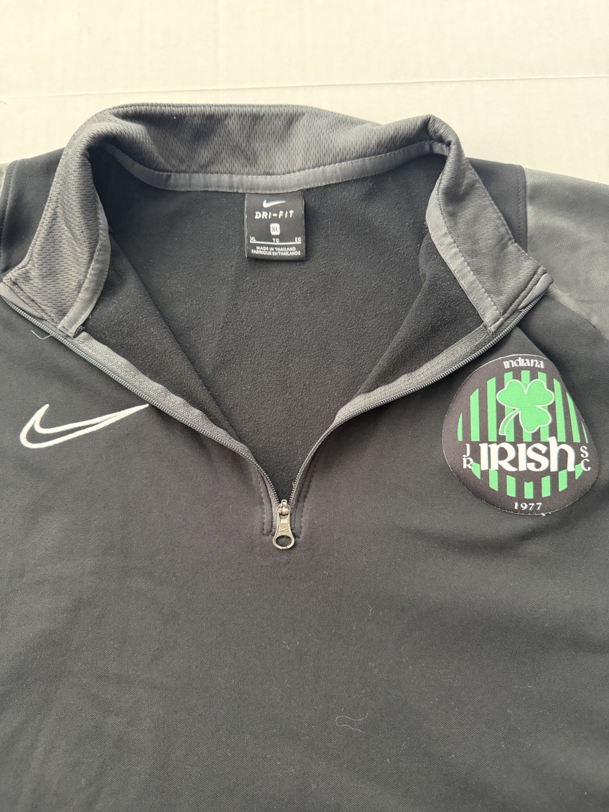 Black and Gray Nike Dri-FIT quarter-zip pullover with a custom "Irish 2017" logo gallery