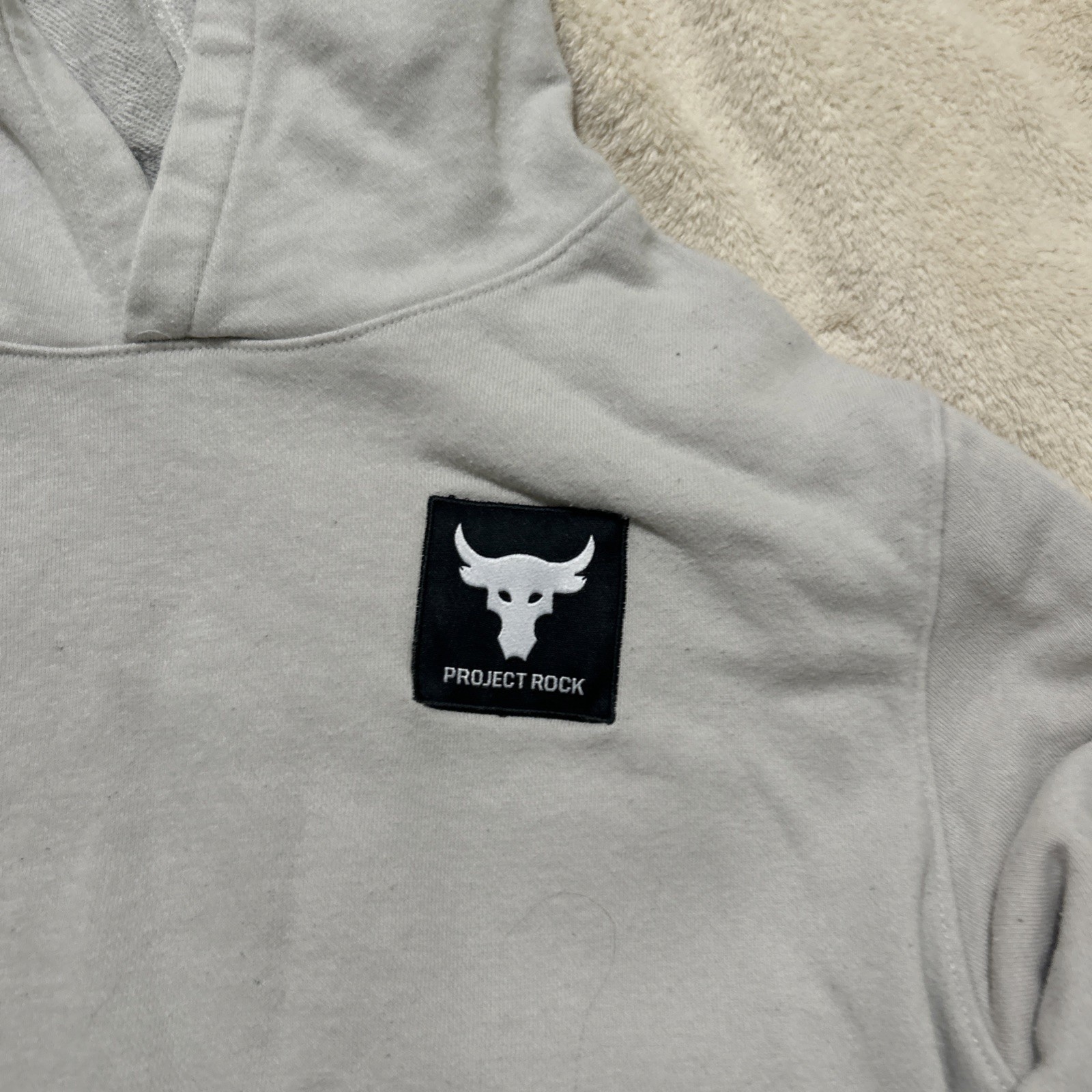 Under Armour Project Rock Long sleeve Hooded Shirt Size YXL Beige Gently Used gallery
