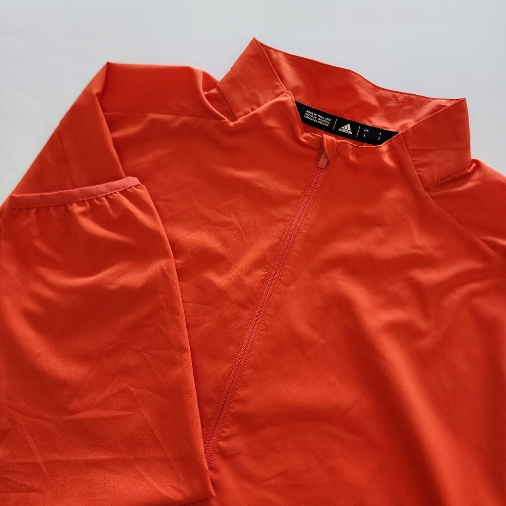 Adidas orange long sleeve golf windbreaker pullover 1/4 zip mens size L gallery