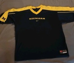 vintage Nike Michigan Wolverines navy blue and yellow football warm-up jersey.