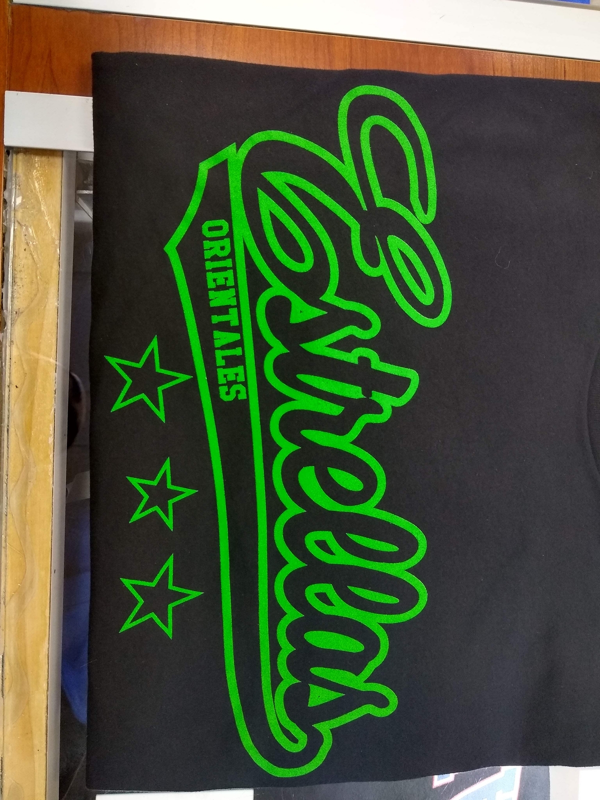 Estrellas Orientales black letter-green-border T-Shirts gallery